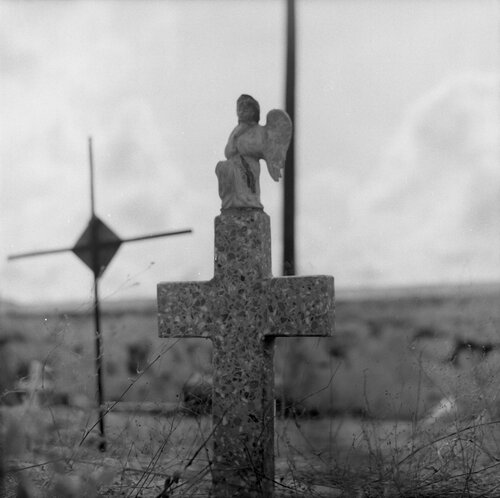 black and white photo of a grave marker