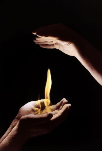 photograph, hands with flames