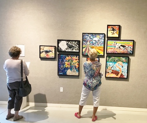 women viewing an art exhibition